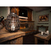 The Bio Flame XL Firebox SS 53-Inch Built-in Ethanol Fireplace - A cozy fireplace adorned with a woven basket resting on top