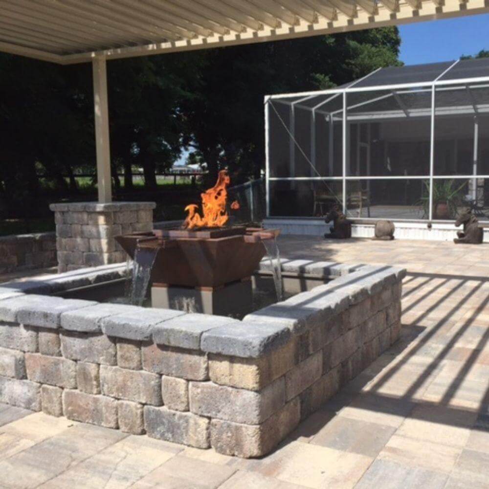 Outdoor Plus Olympian 60" 4-Way Copper Gas Fire and Water Bowl - Match Lit (OPT-OLS60S) - Outdoor patio with stone fire pit and seating area