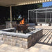 Outdoor Plus Olympian 60" 4-Way Copper Gas Fire and Water Bowl - Match Lit (OPT-OLS60S) - Outdoor patio with stone fire pit and seating area